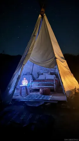 a bed sitting in a room next to a window