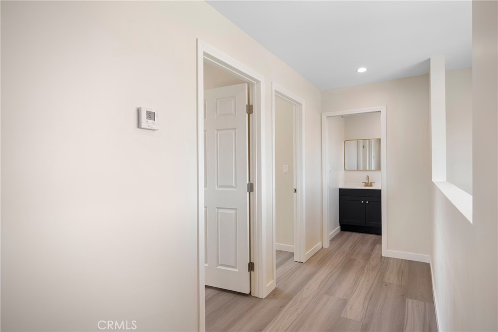 8435 Rincon Avenue Sun Valley, CA 91352 - Photo 46 of 61 a view of a hallway with wooden floor and closet