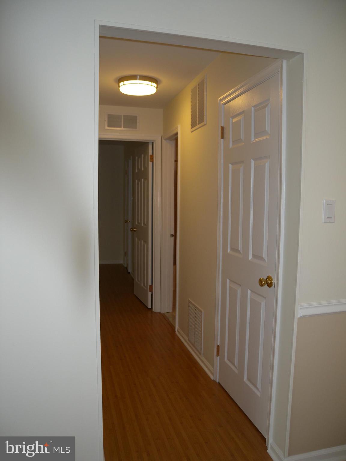 1907 A Sutton Place Mount Laurel, NJ 08054 - Photo 19 of 23 a view of a livingroom with wooden floor