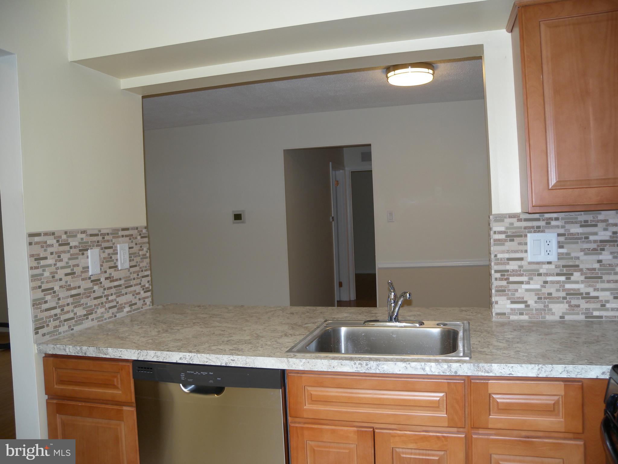 1907 A Sutton Place Mount Laurel, NJ 08054 - Photo 6 of 23 a bathroom with a granite countertop sink and a mirror