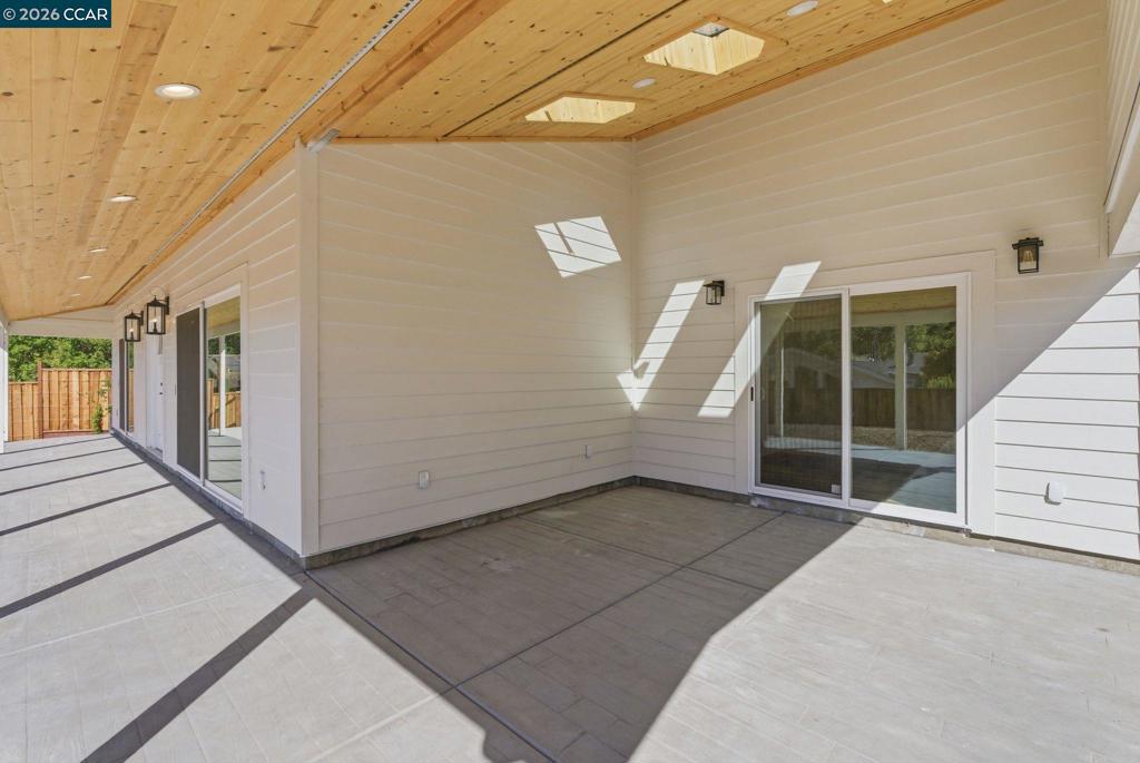 3196 Rohrer Drive Lafayette, CA 94549 - Photo 17 of 30 a view of a hallway with wooden walls and stairs