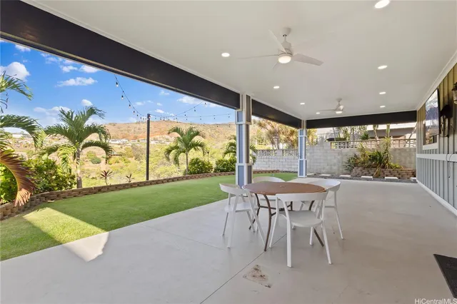 a dining room with furniture and a garden