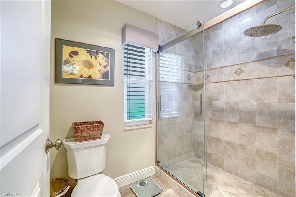 401 Panay Avenue Naples, FL 34113 - Photo 26 of 47 a white toilet sitting next to a bathroom sink