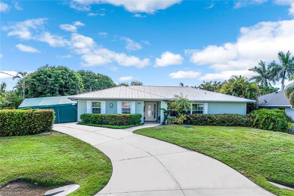 401 Panay Avenue Naples, FL 34113 - Photo 3 of 47 a view of a house with a yard