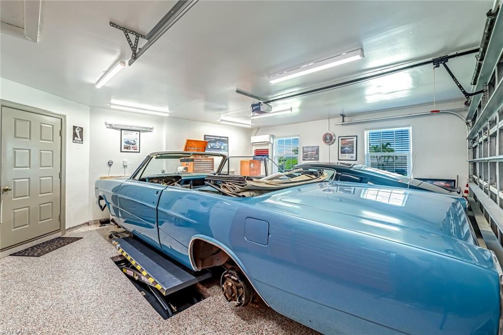 401 Panay Avenue Naples, FL 34113 - Photo 33 of 47 a room with a view of gym equipment