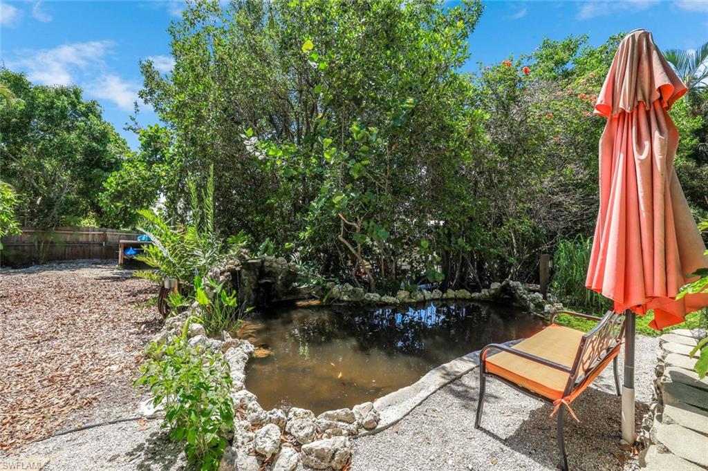 401 Panay Avenue Naples, FL 34113 - Photo 37 of 47 a view of a backyard with sitting area