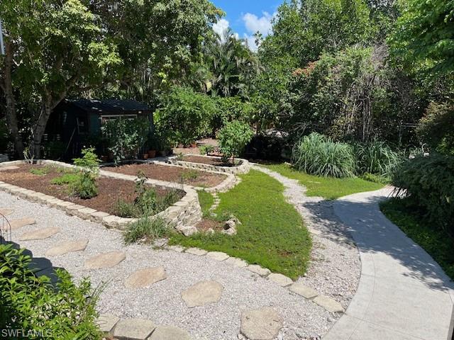 401 Panay Avenue Naples, FL 34113 - Photo 43 of 47 a view of a backyard with green space
