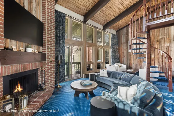 a outdoor space with furniture and a fireplace