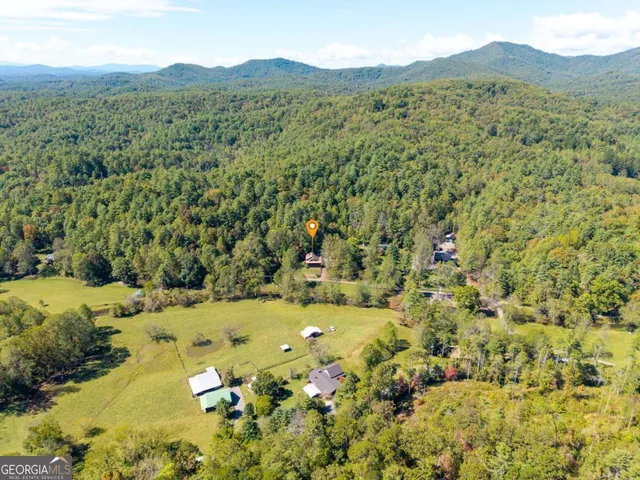 a living room with fireplace furniture and a flat screen tv