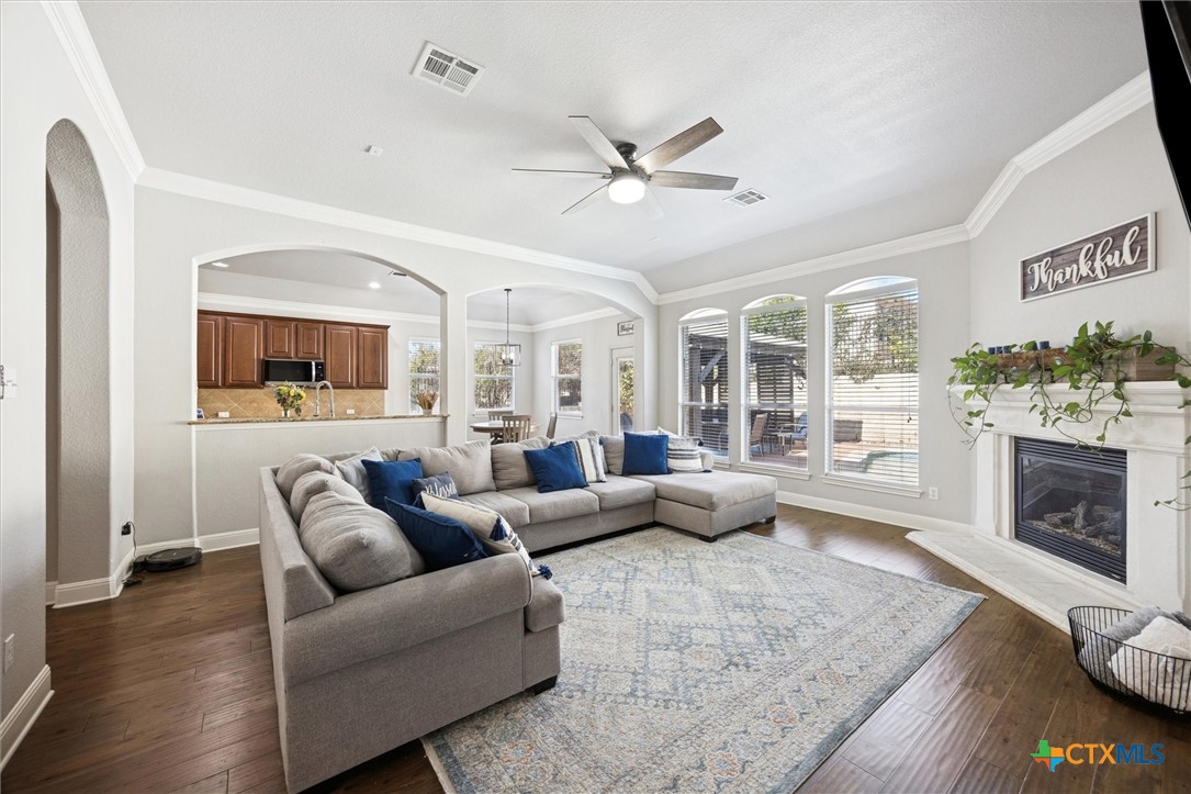 2309 First View Leander, TX 78641 - Photo 11 of 31 This expansive family room connects naturally to the kitchen and breakfast area, creating a central gathering place filled with natural light.