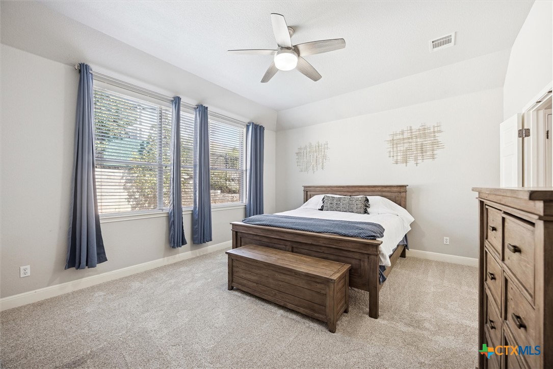 2309 First View Leander, TX 78641 - Photo 18 of 31 The primary bedroom features soft natural light, generous space, and a calm atmosphere ideal for relaxing at the end of the day.