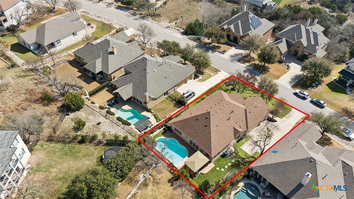 2309 First View Leander, TX 78641 - Photo 28 of 31 An aerial perspective showcases the home’s spacious lot, highlighting the backyard retreat with pool and outdoor entertaining areas.