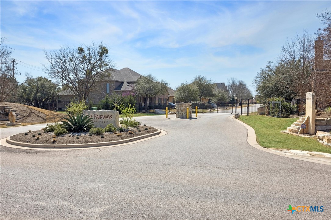 2309 First View Leander, TX 78641 - Photo 29 of 31 The gated entrance to The Fairways Private Estates offers a welcoming arrival and added sense of privacy for residents.