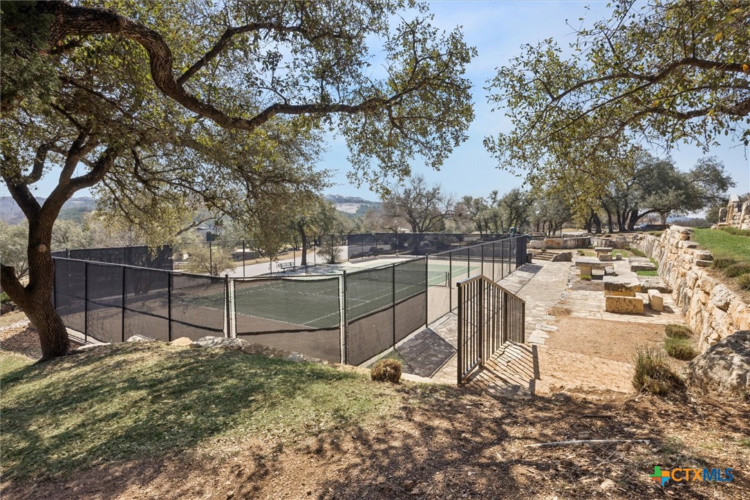 2309 First View Leander, TX 78641 - Photo 30 of 31 Residents enjoy access to community tennis courts surrounded by mature trees and scenic hill country views