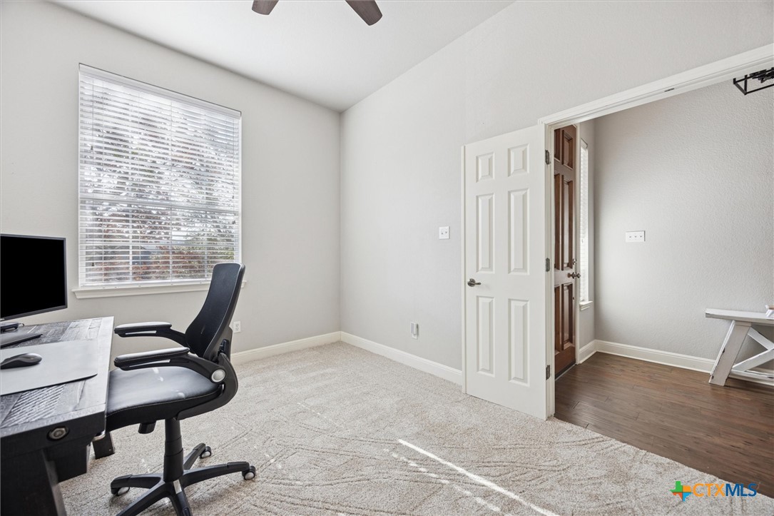 2309 First View Leander, TX 78641 - Photo 5 of 31 A dedicated home office provides a quiet, comfortable space ideal for working remotely, studying, or managing daily tasks.