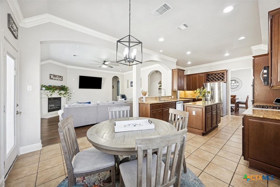 2309 First View Leander, TX 78641 - Photo 8 of 31 The kitchen opens seamlessly to the family room allowing easy connection between cooking, dining, and everyday living.