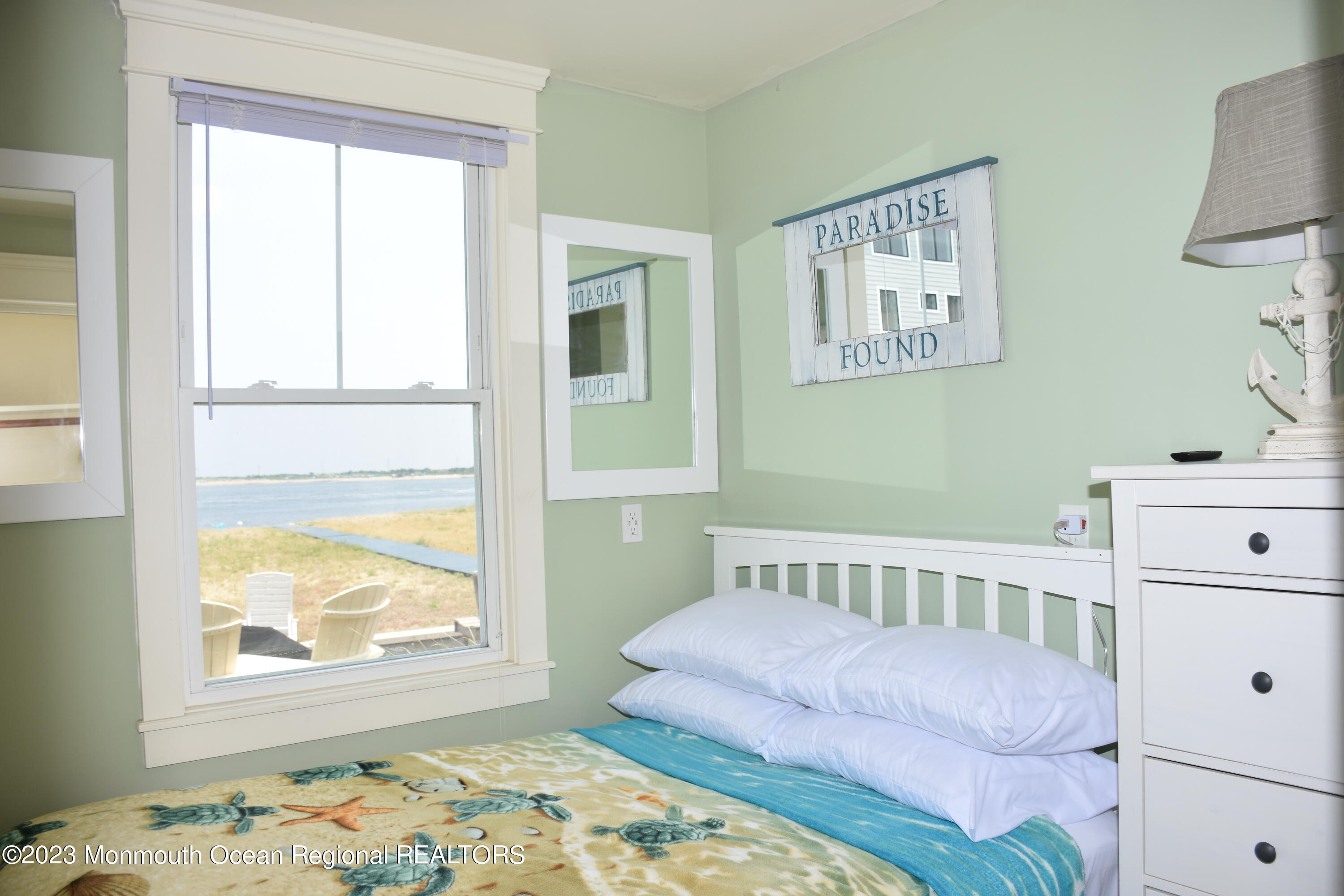 58 5th Street, Unit F Highlands, NJ 07732 - Photo 17 of 33 a bedroom with a bed and a window