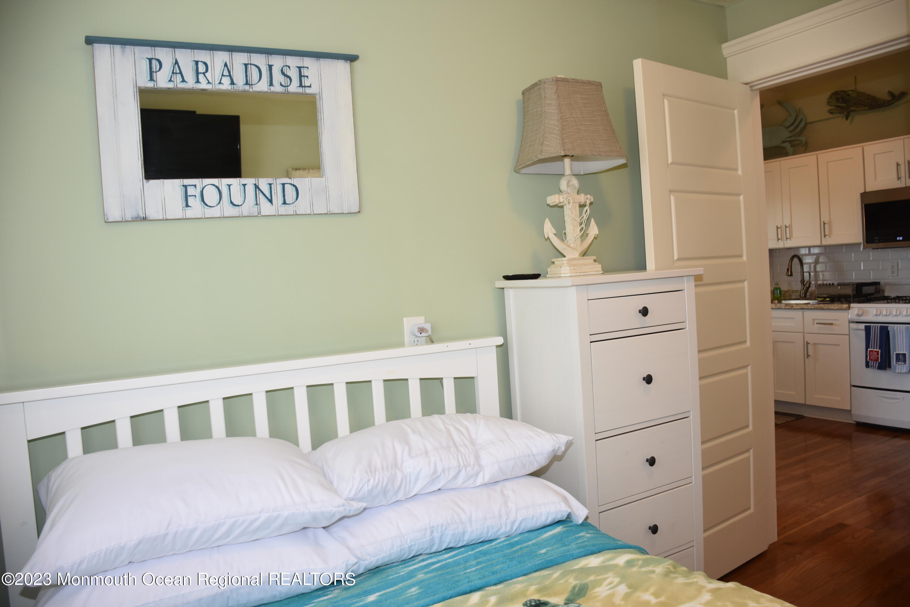 58 5th Street, Unit F Highlands, NJ 07732 - Photo 19 of 33 a living room with furniture and a flat screen tv