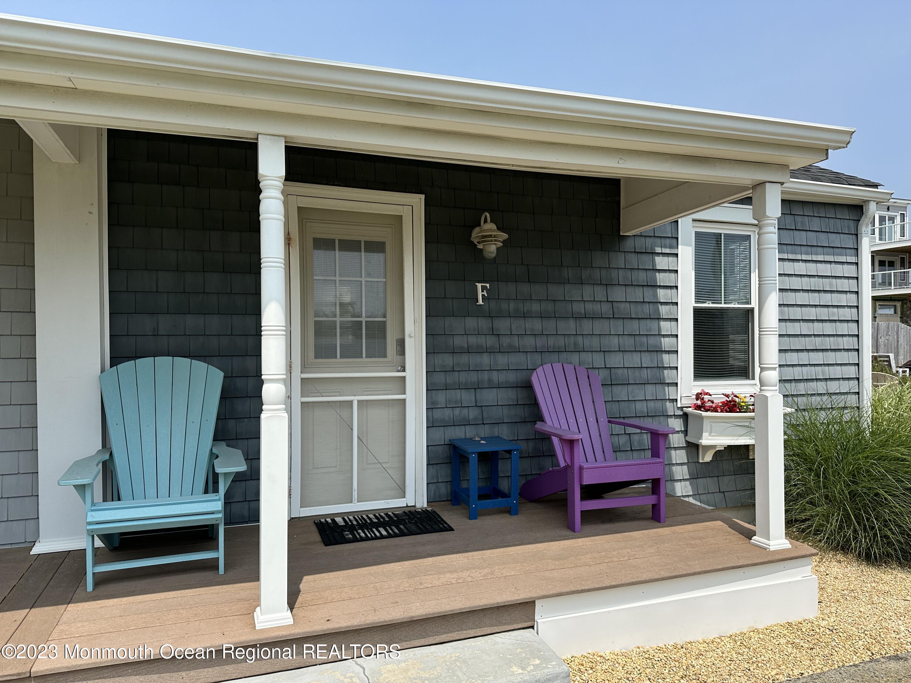 58 5th Street, Unit F Highlands, NJ 07732 - Photo 2 of 33 a view of front door of house with outdoor seating