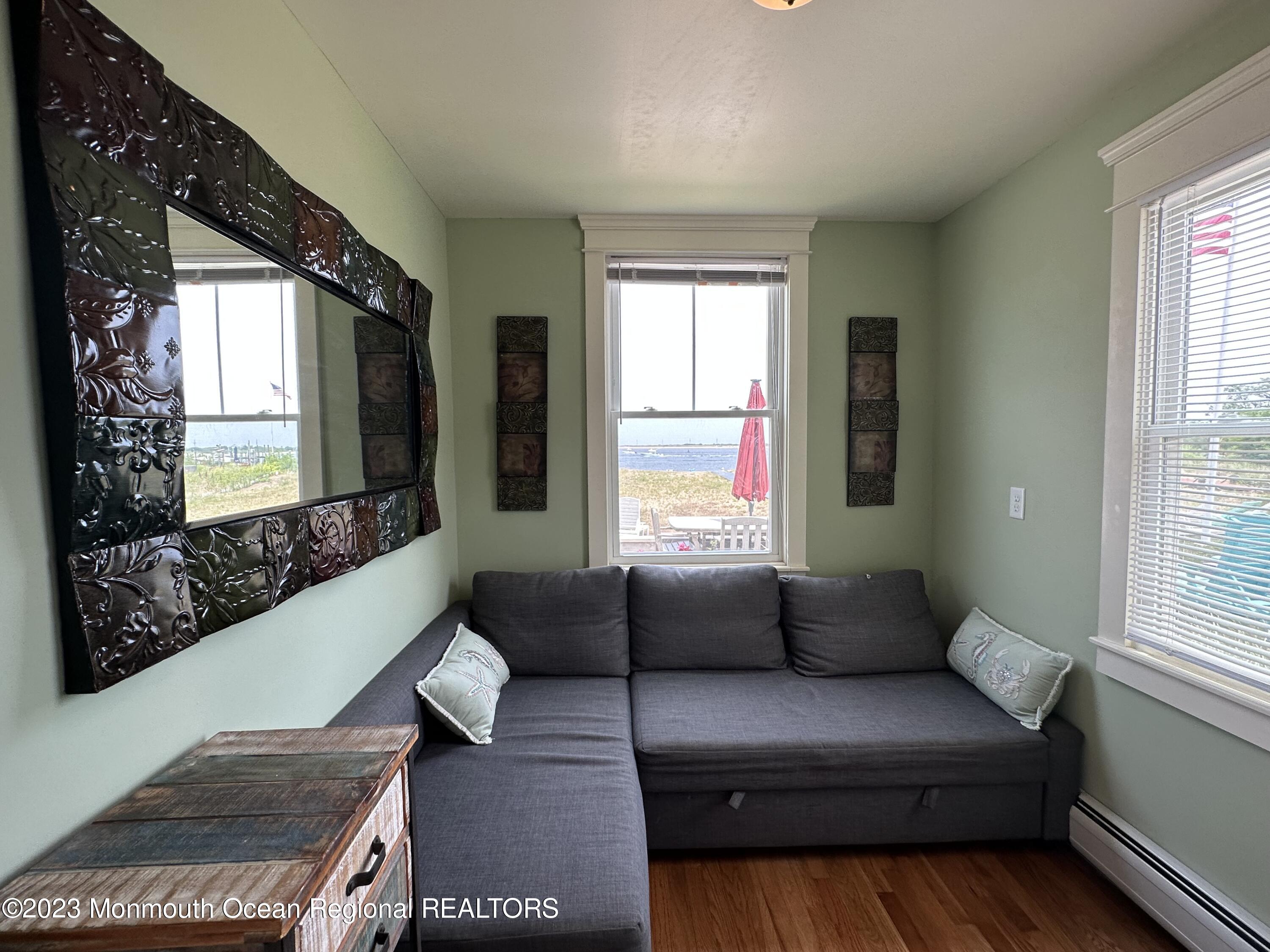 58 5th Street, Unit F Highlands, NJ 07732 - Photo 21 of 33 a living room with furniture and a large window