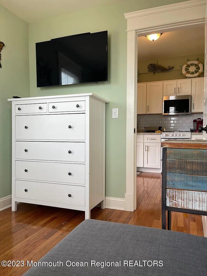 58 5th Street, Unit F Highlands, NJ 07732 - Photo 22 of 33 a view of kitchen with cabinets and flat screen tv