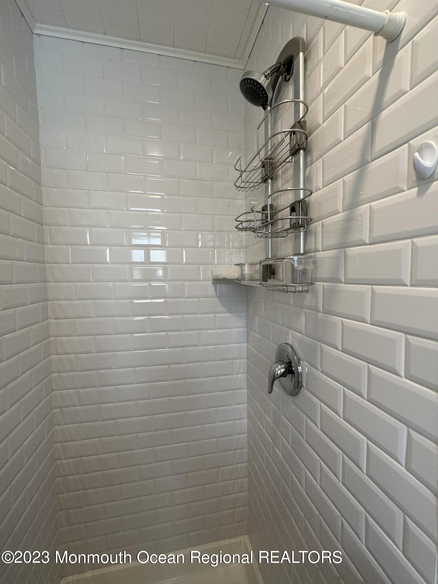 58 5th Street, Unit F Highlands, NJ 07732 - Photo 27 of 33 a bathroom with a shower