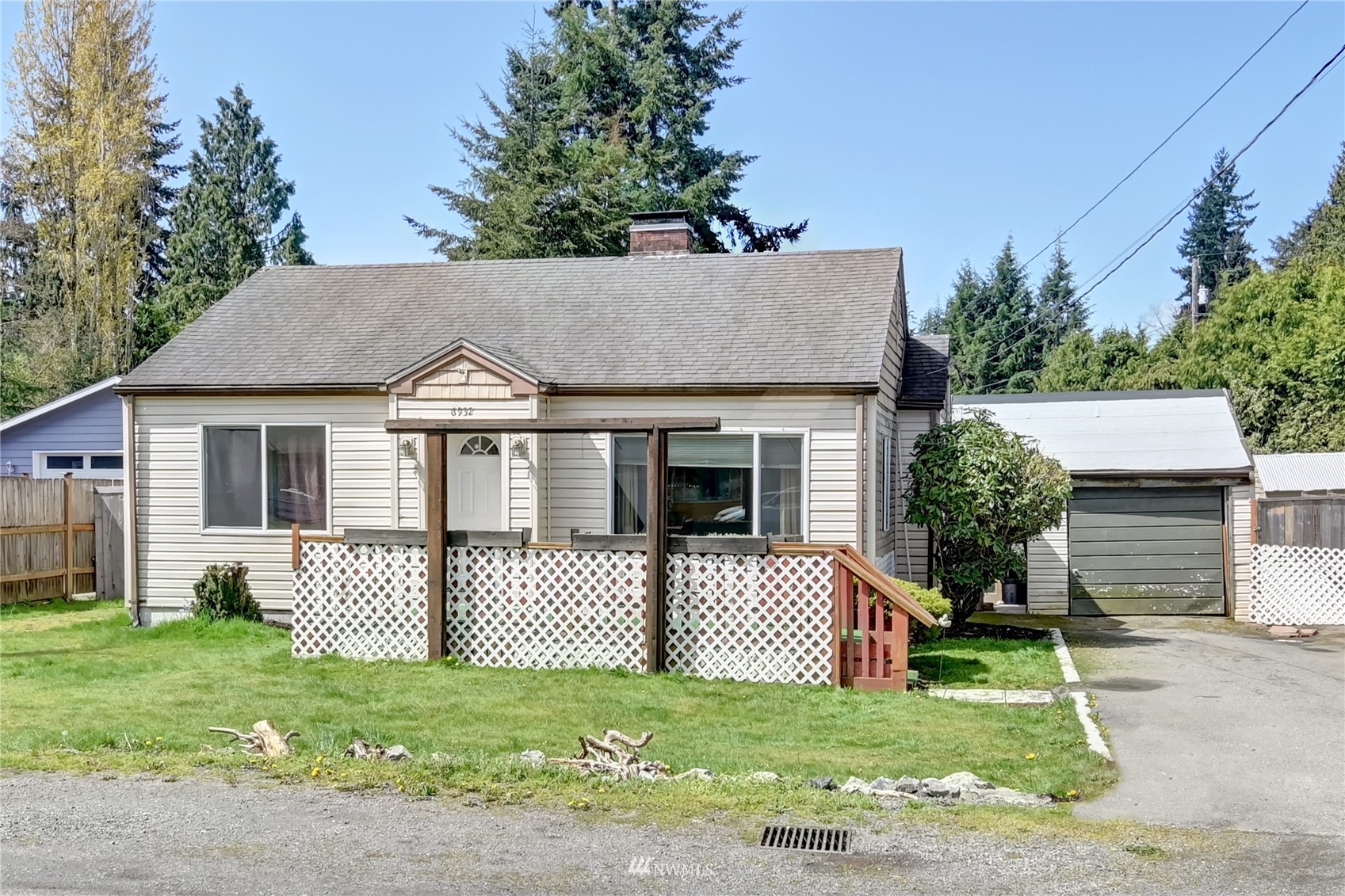 6932 Carson Road Everett, WA 98203 - Photo 1 of 24 a front view of a house with a garden