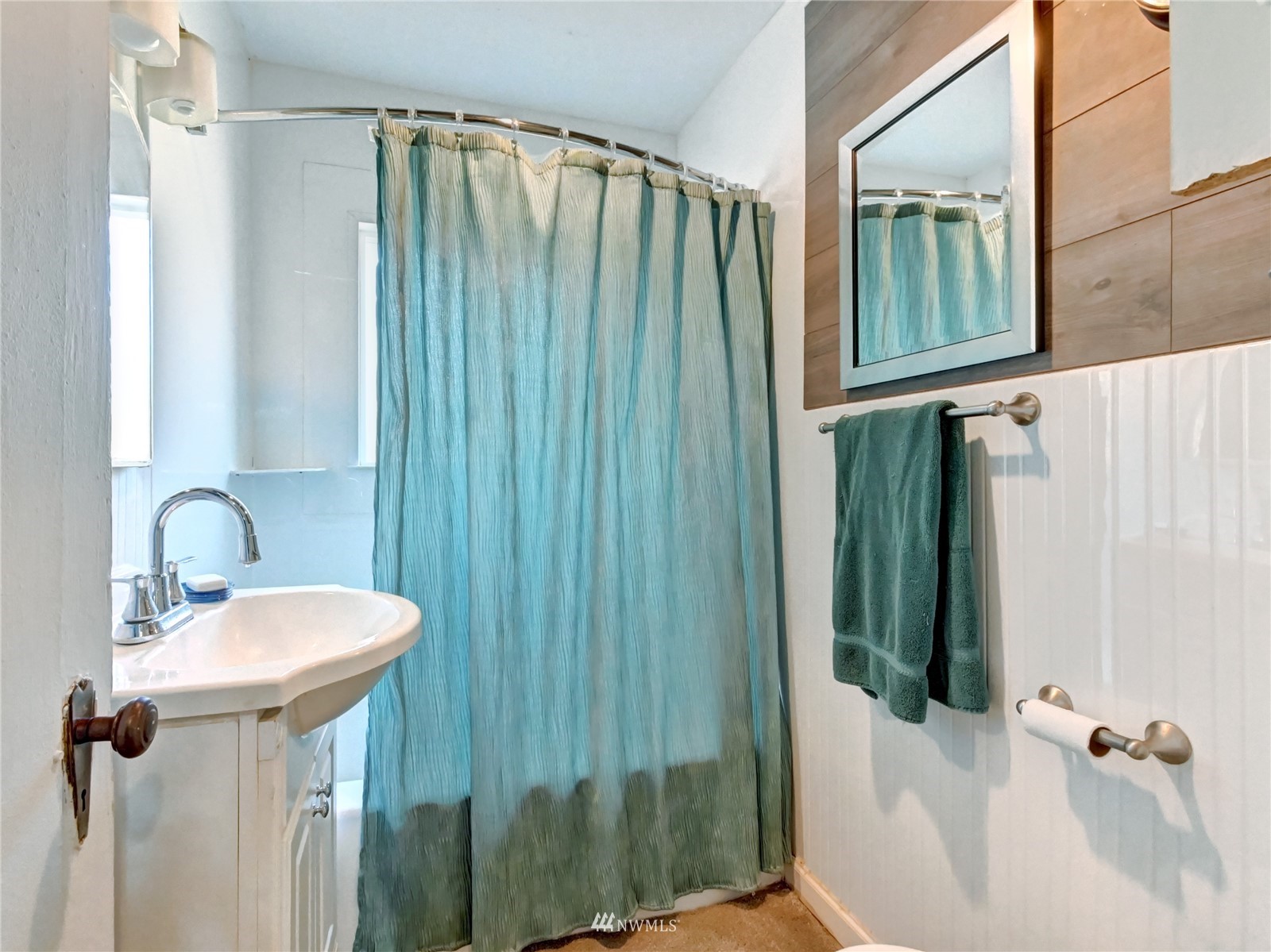 6932 Carson Road Everett, WA 98203 - Photo 16 of 24 a bathroom with a sink a toilet and shower