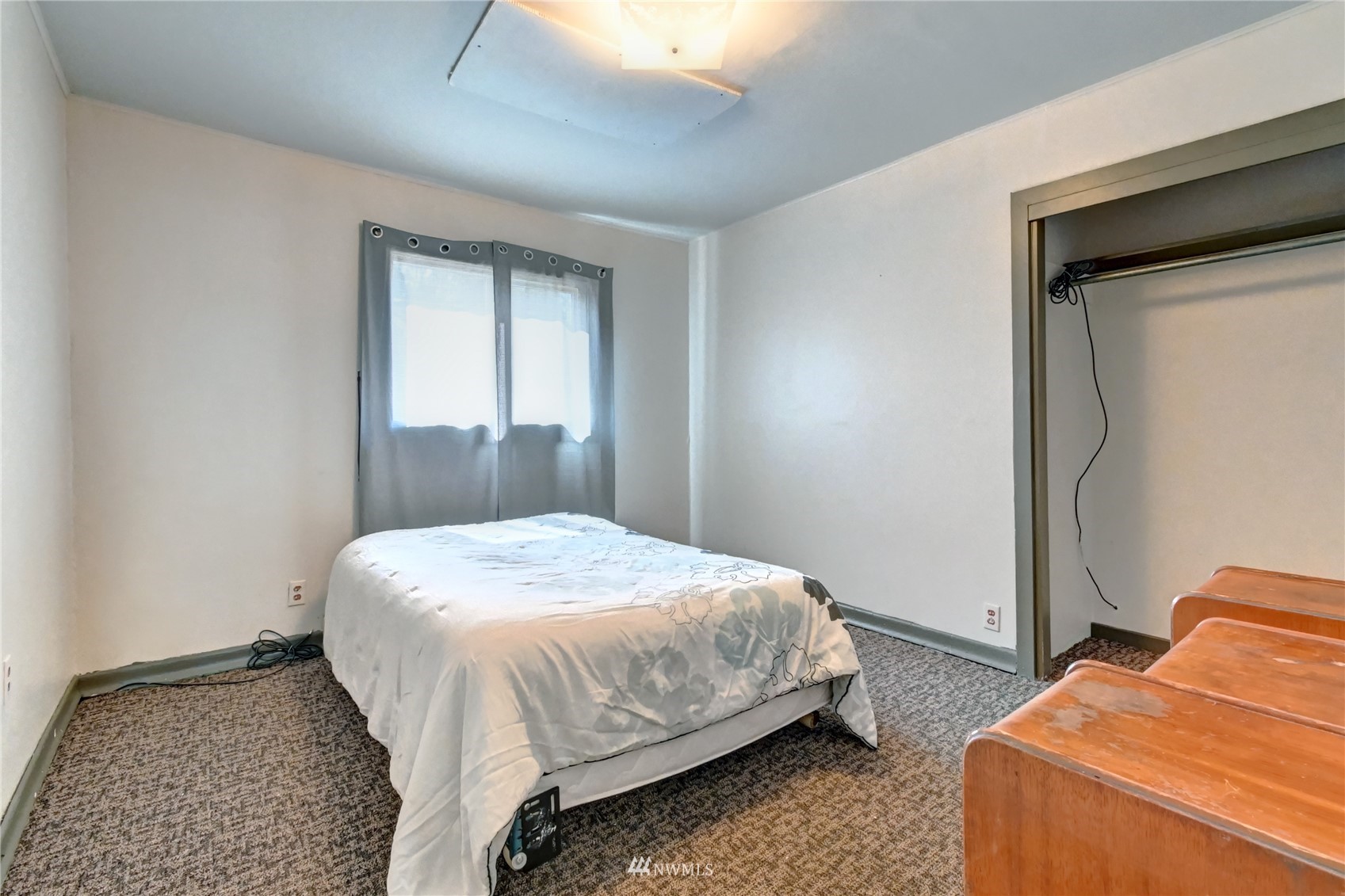6932 Carson Road Everett, WA 98203 - Photo 17 of 24 a bedroom with bed and window