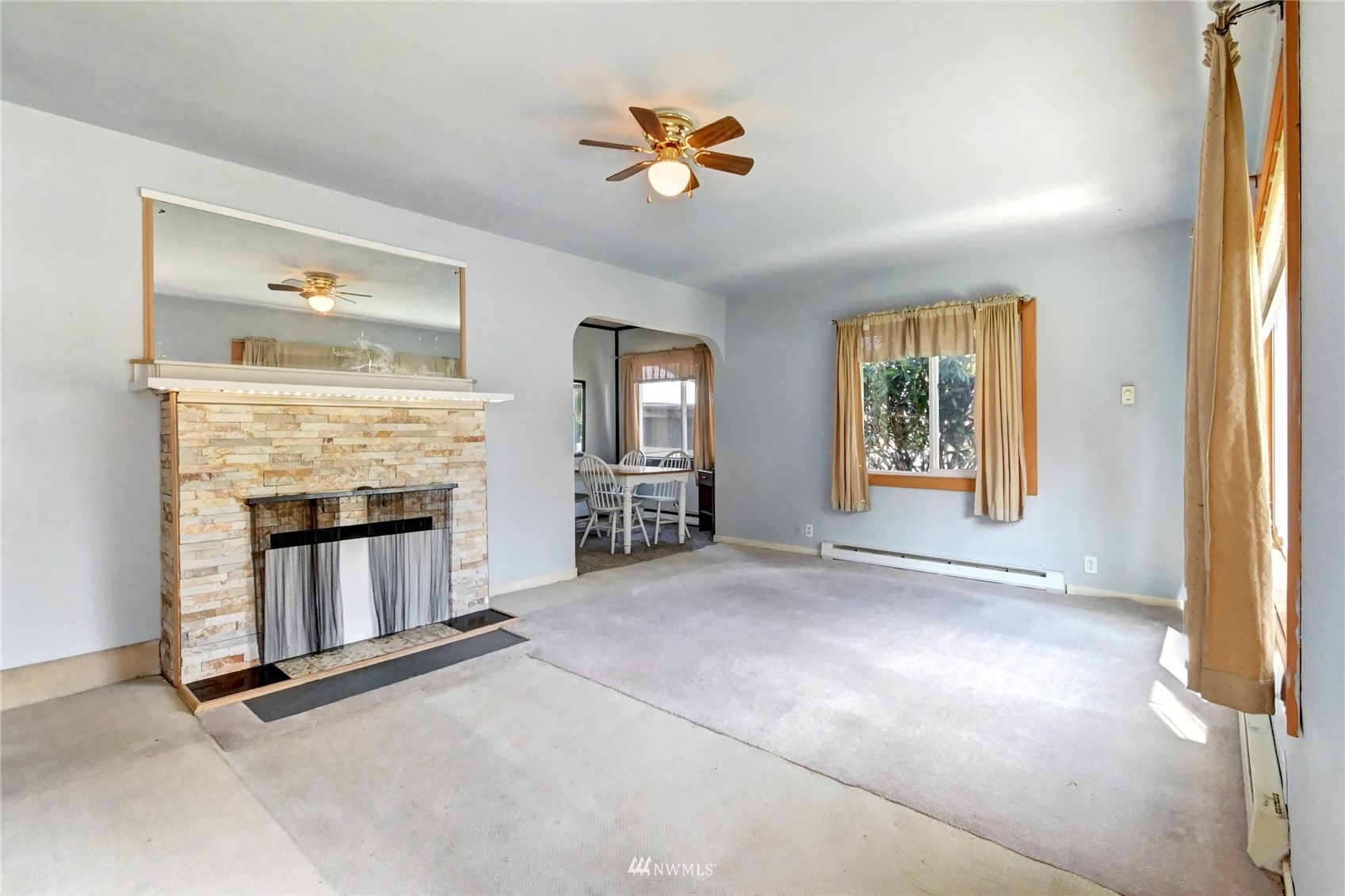 6932 Carson Road Everett, WA 98203 - Photo 3 of 24 an empty room with windows and fireplace
