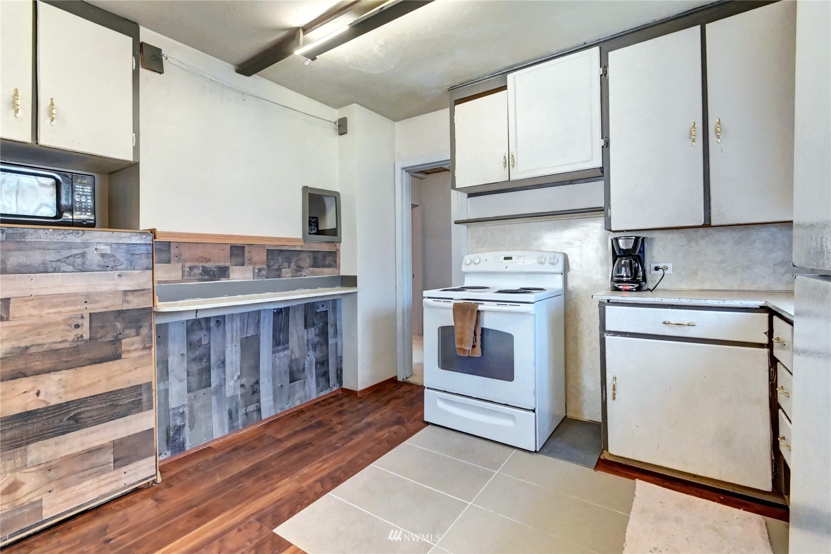 6932 Carson Road Everett, WA 98203 - Photo 10 of 24 a kitchen with stainless steel appliances a stove a sink and a refrigerator