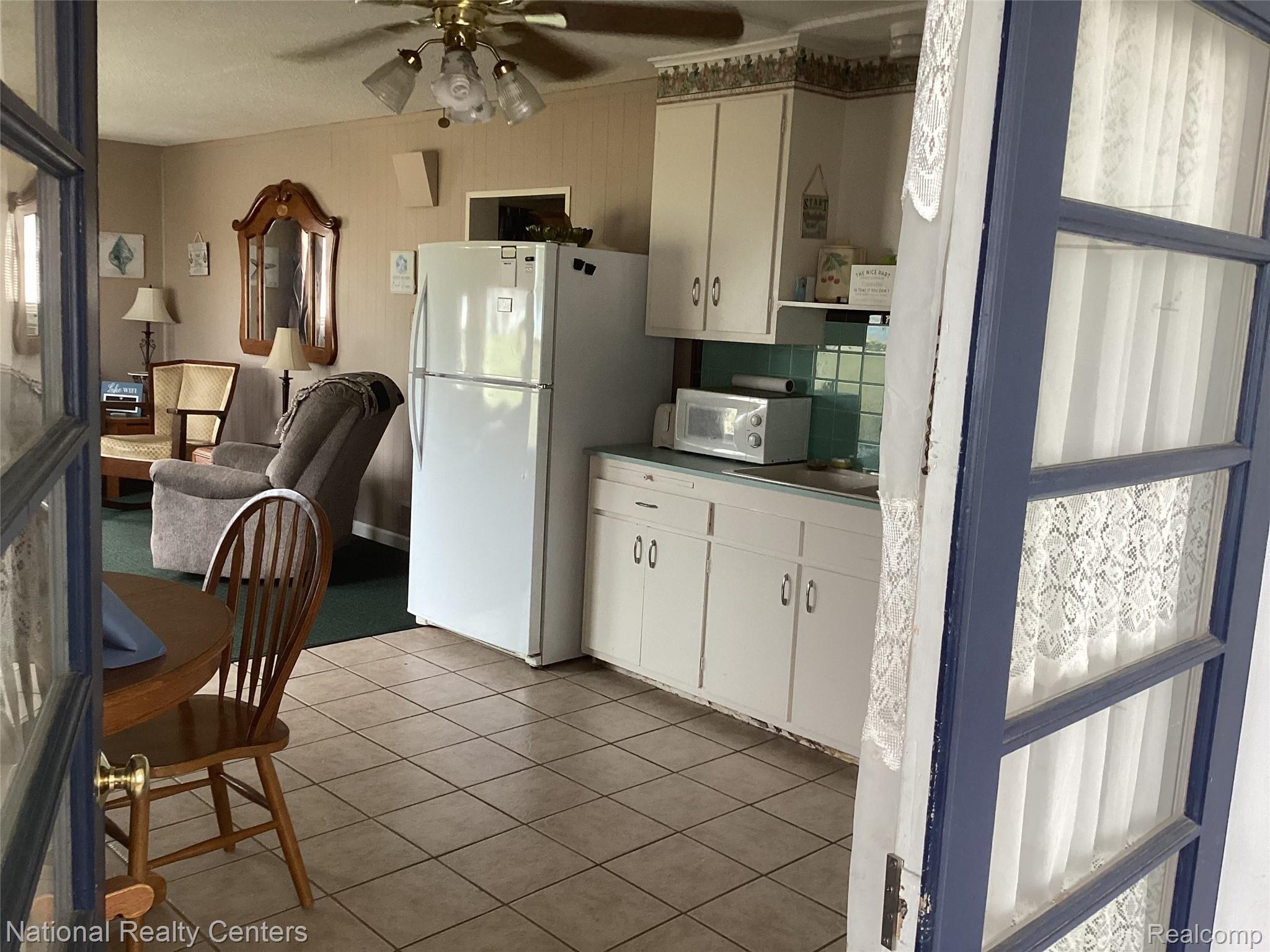 6024 Port Austin Road, Unit 5 Caseville, MI 48725 - Photo 8 of 56 Opens to large kitchen