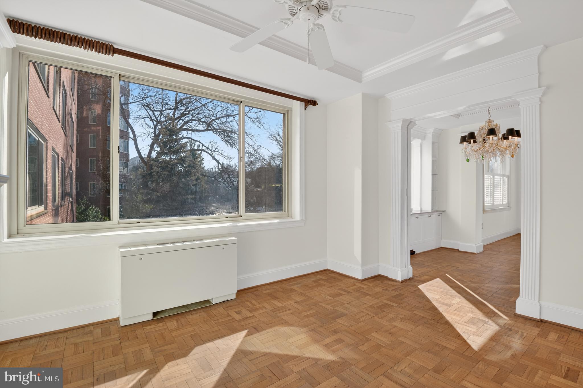 4000 Tunlaw Road Northwest, Unit 415 Washington, DC 20007 - Photo 15 of 28 a view of a bedroom with natural light and hardwood floor