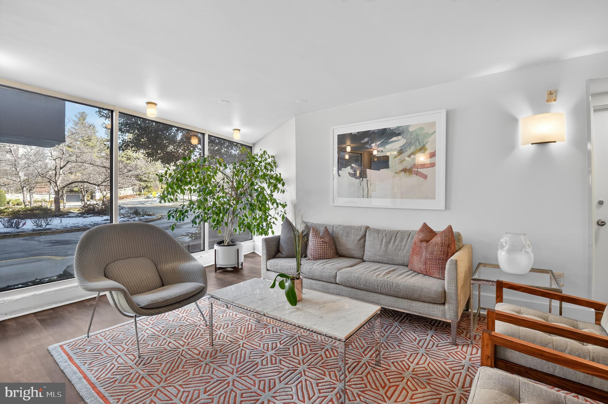 4000 Tunlaw Road Northwest, Unit 415 Washington, DC 20007 - Photo 20 of 28 a living room with furniture and a large window