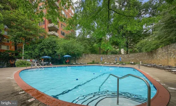 a view of a swimming pool with a patio