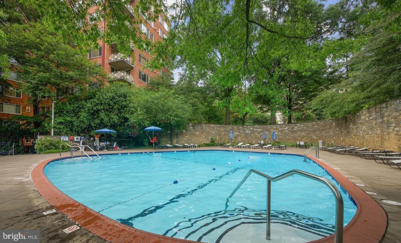 4000 Tunlaw Road Northwest, Unit 415 Washington, DC 20007 - Photo 24 of 28 a view of a swimming pool with a patio
