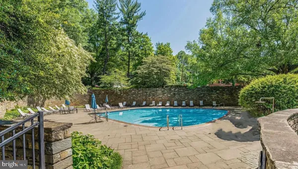 a view of a swimming pool with a patio