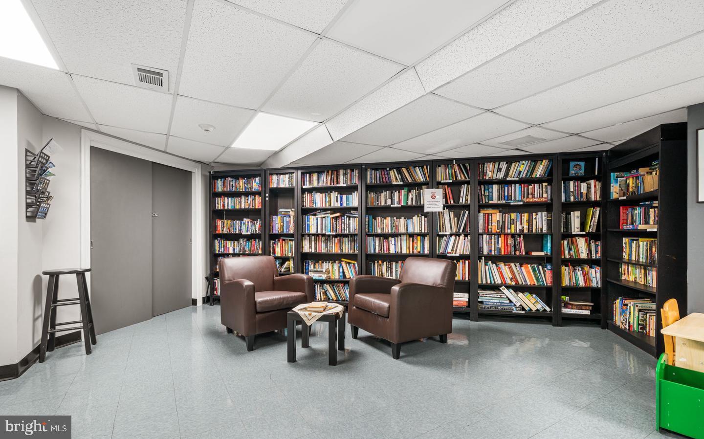 4000 Tunlaw Road Northwest, Unit 415 Washington, DC 20007 - Photo 28 of 28 a reading room with furniture and book shelf