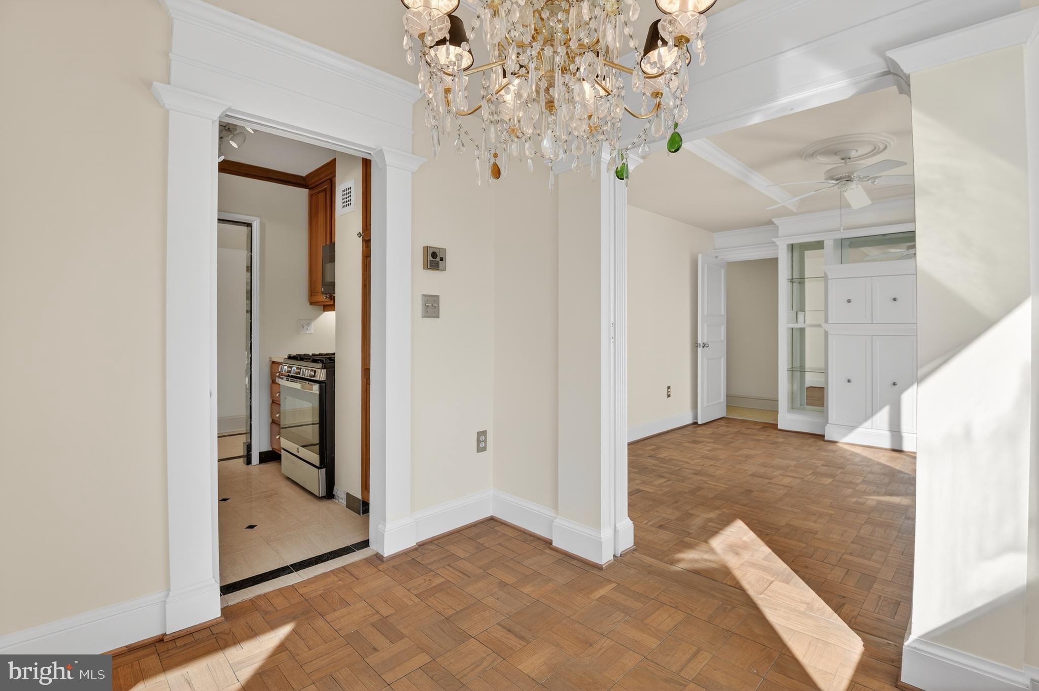 4000 Tunlaw Road Northwest, Unit 415 Washington, DC 20007 - Photo 7 of 28 a view of a hallway view with chandelier