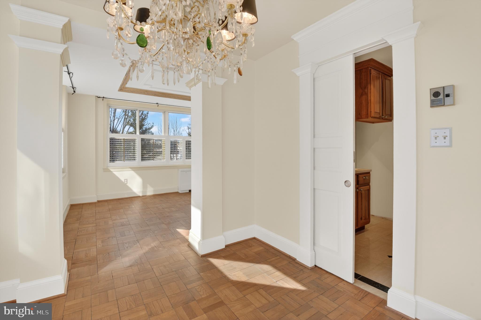 4000 Tunlaw Road Northwest, Unit 415 Washington, DC 20007 - Photo 9 of 28 a view of entryway with a chandelier and livingroom view