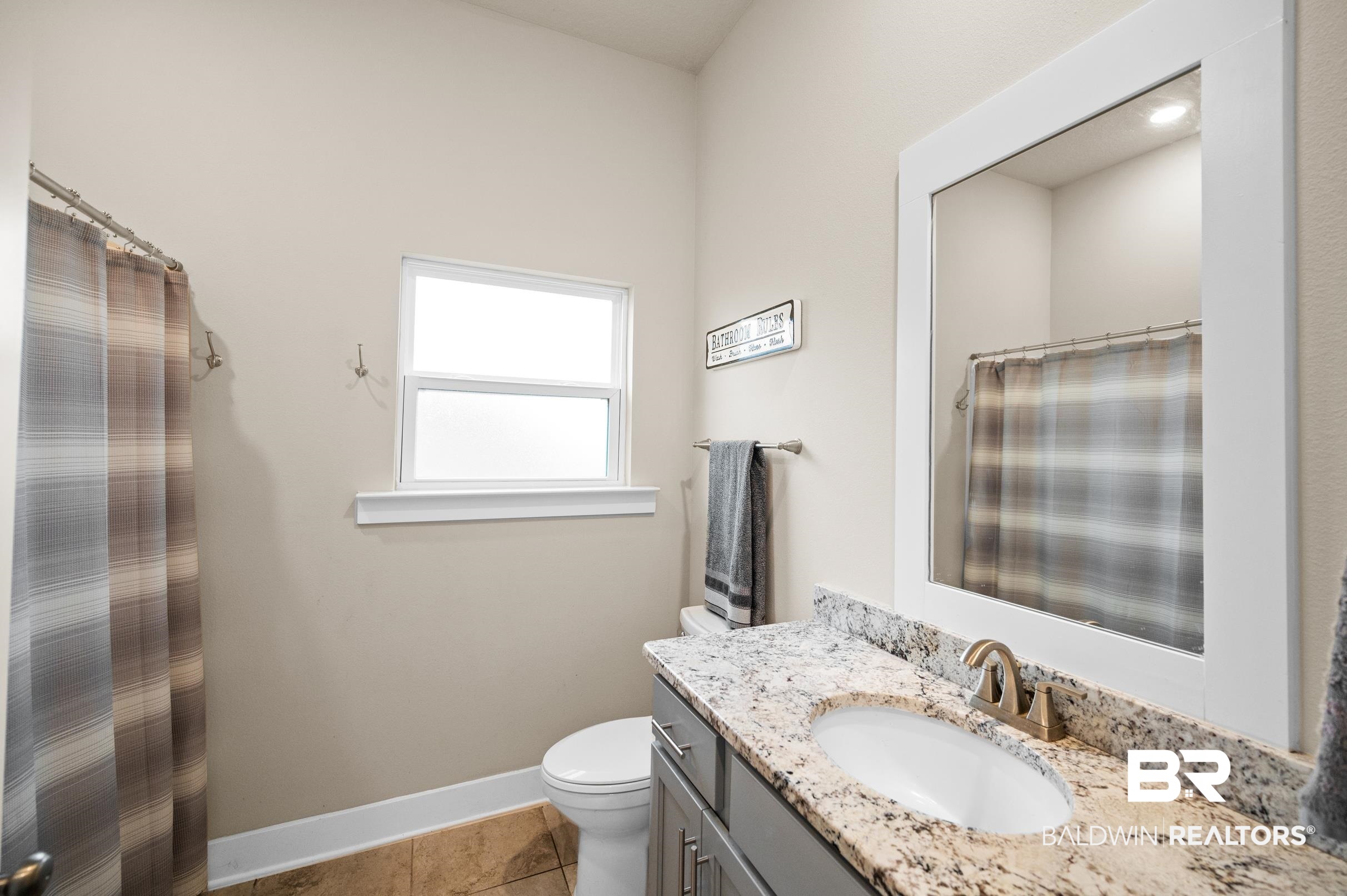31355 Limpkin Street Daphne, AL 36527 - Photo 44 of 57 Bathroom featuring tile patterned floors, vanity, and toilet