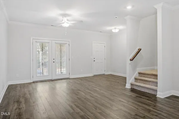 a view of entryway with wooden floor