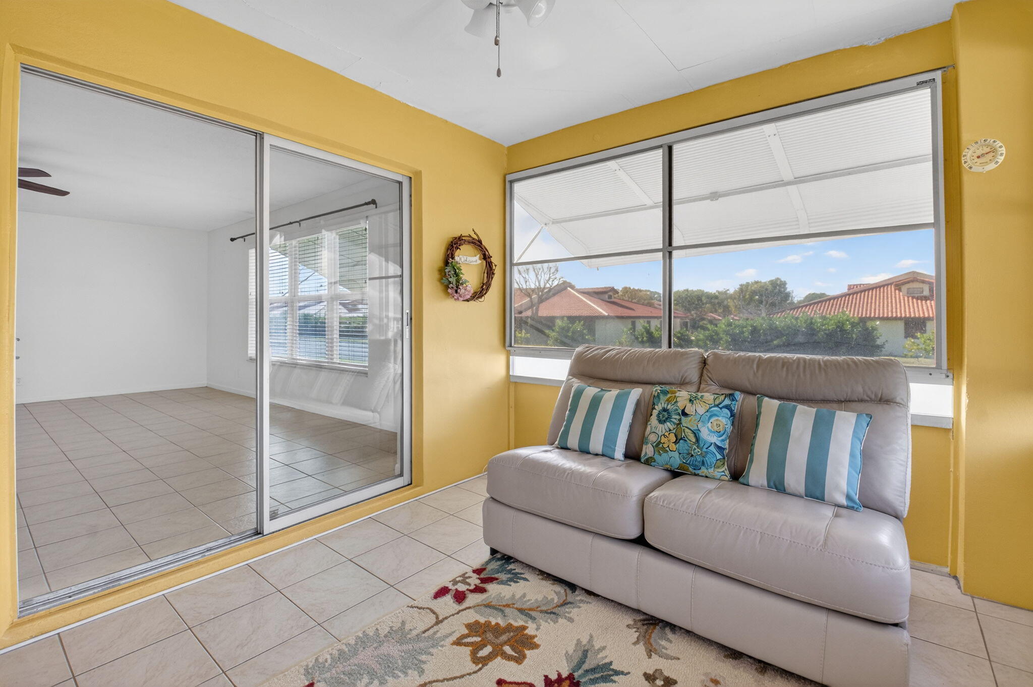 270 High Point Court, Unit D Boynton Beach, FL 33435 - Photo 16 of 41 a living room with furniture and a floor to ceiling window