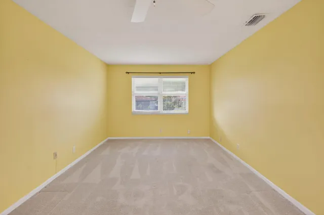 an empty room with a empty space and a window