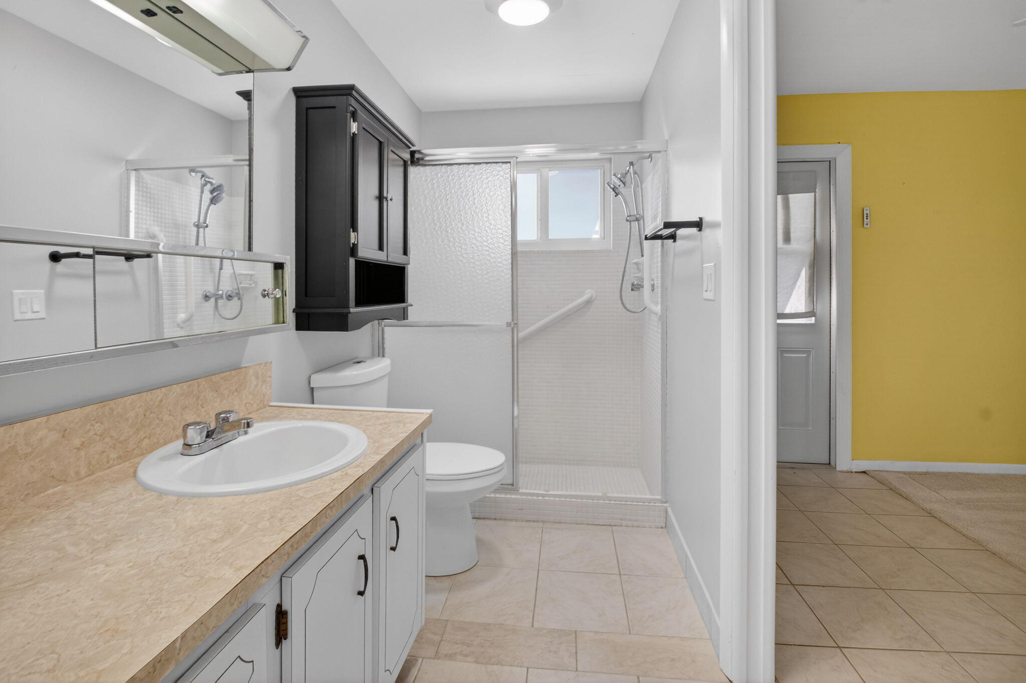 270 High Point Court, Unit D Boynton Beach, FL 33435 - Photo 22 of 41 a bathroom with a sink toilet and shower