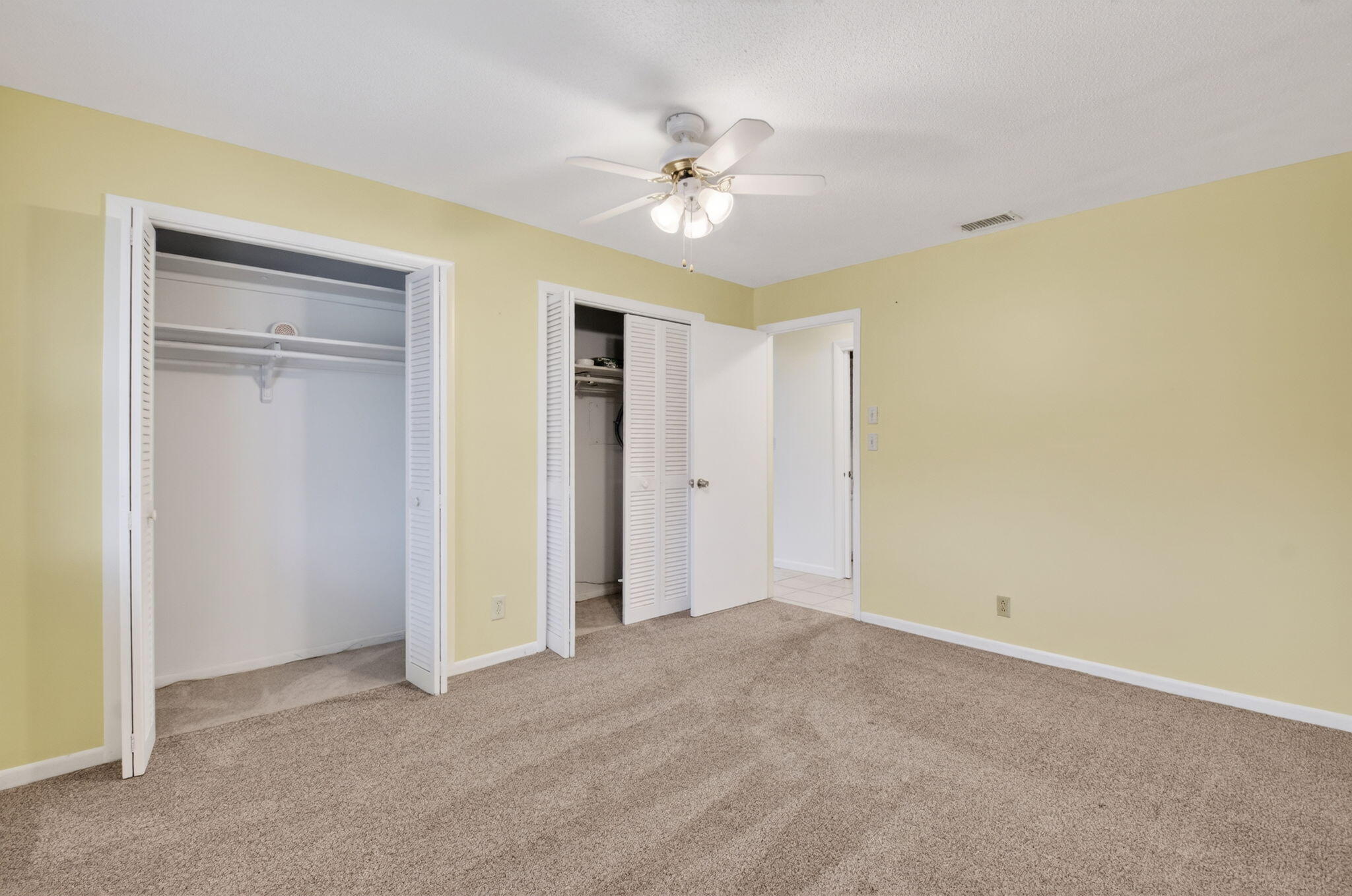 270 High Point Court, Unit D Boynton Beach, FL 33435 - Photo 26 of 41 a view of a livingroom with a ceiling fan and a carpet