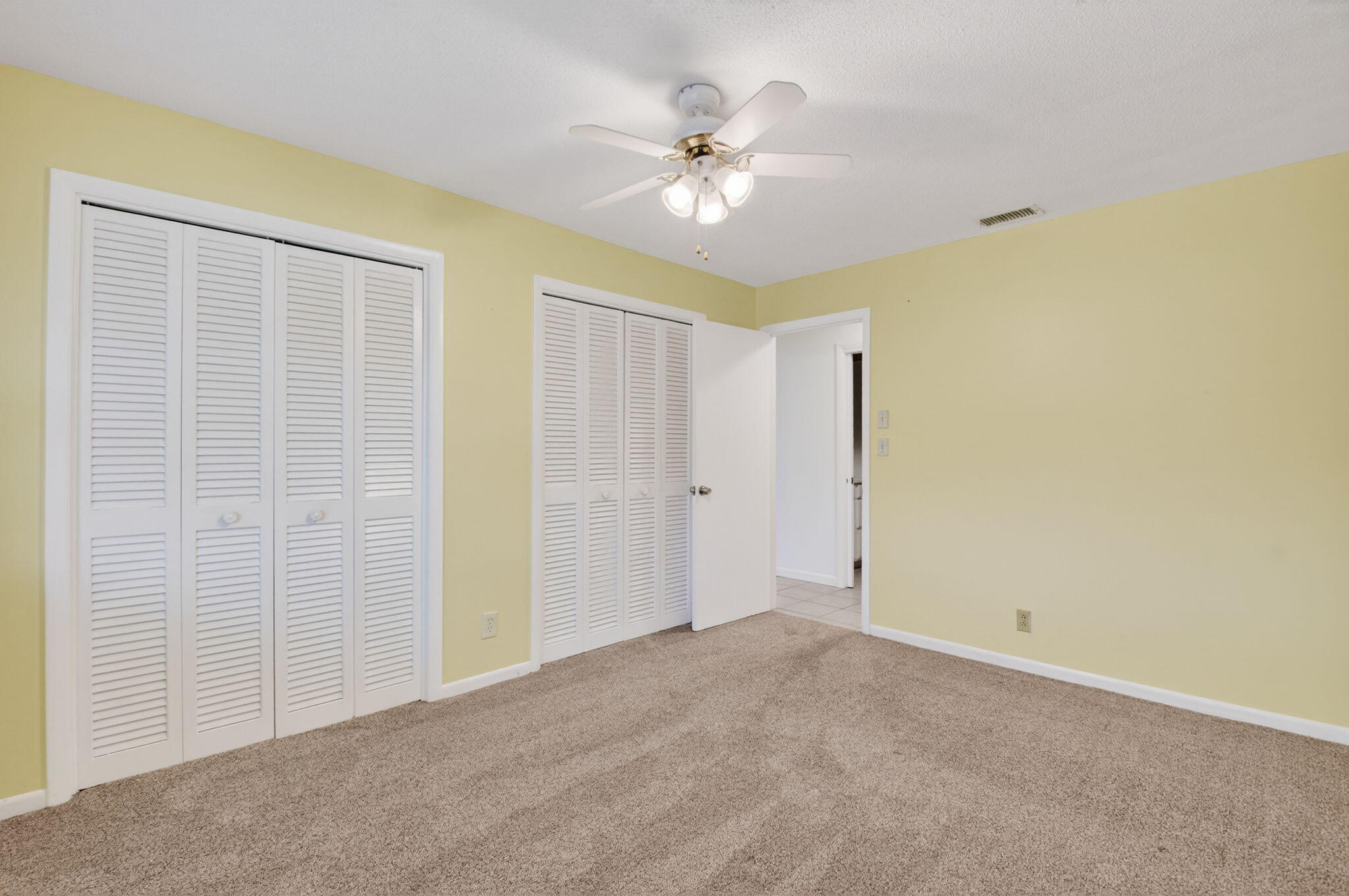 270 High Point Court, Unit D Boynton Beach, FL 33435 - Photo 27 of 41 a view of an empty room with a ceiling fan