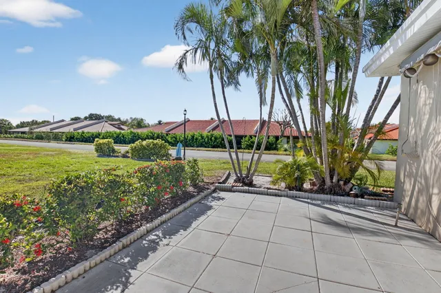 a view of a garden with a slide and a lake view