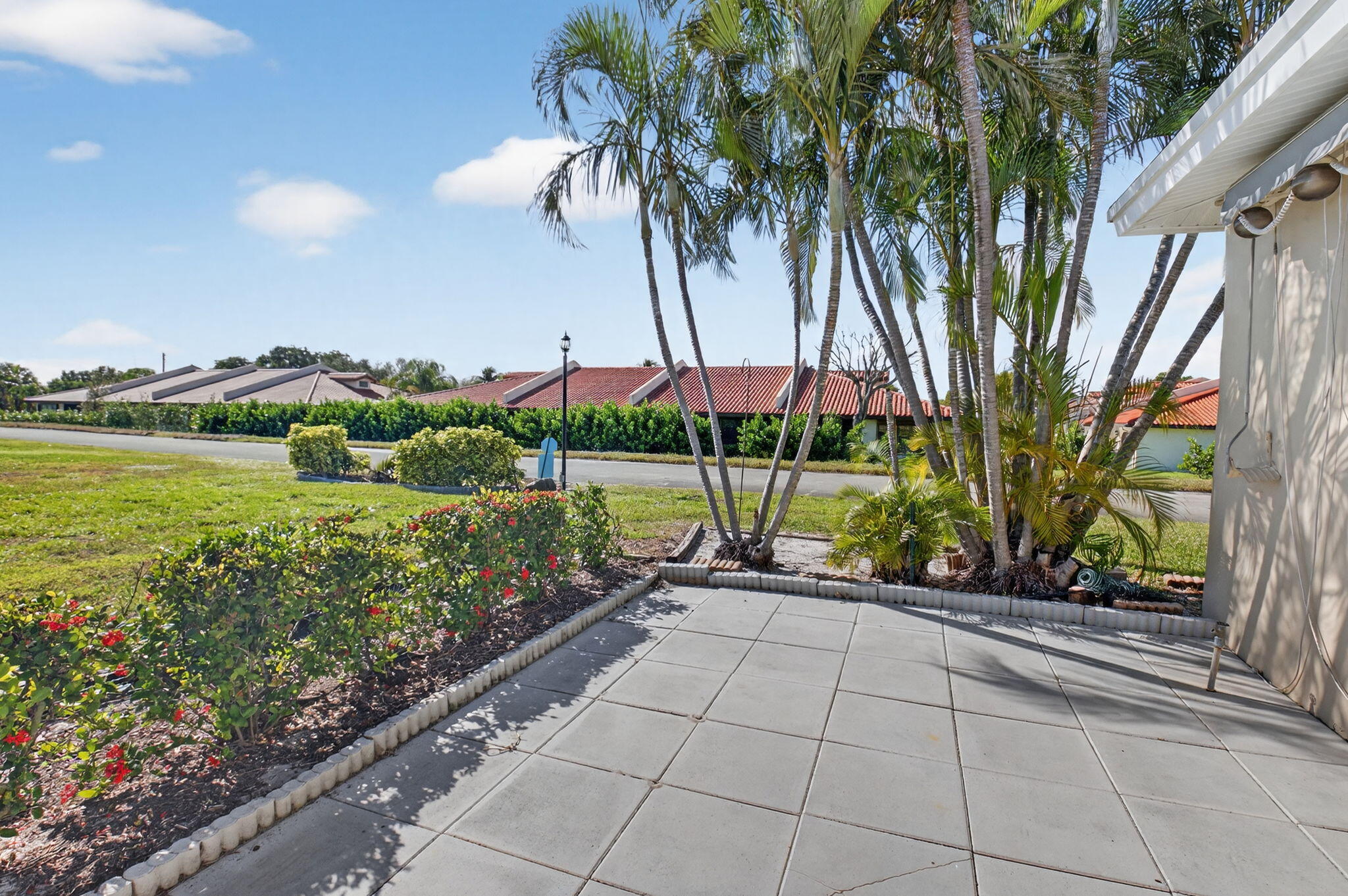 270 High Point Court, Unit D Boynton Beach, FL 33435 - Photo 30 of 41 a view of a garden with a slide and a lake view