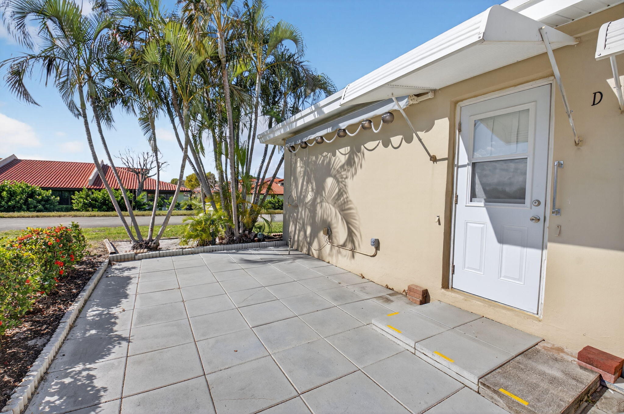 270 High Point Court, Unit D Boynton Beach, FL 33435 - Photo 31 of 41 a front view of a house with garden